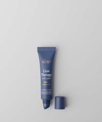 City Lips Line Therapy by City Beauty – Define & Smooth, 0.34 fl oz, open dark navy blue tube with cap removed beside it on a light gray background